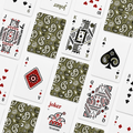 A flat-lay arrangement of playing cards from The Card Room, featuring both front and back designs. The cards display various suit icons, including hearts, spades, clubs, and diamonds, as well as the Joker and King of Spades.